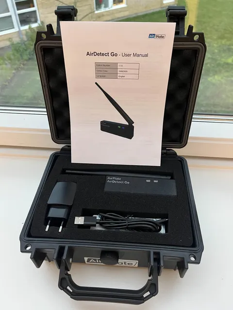 AirDetect Go in its carry case with the antenna, USB-C cable, charger and user manual