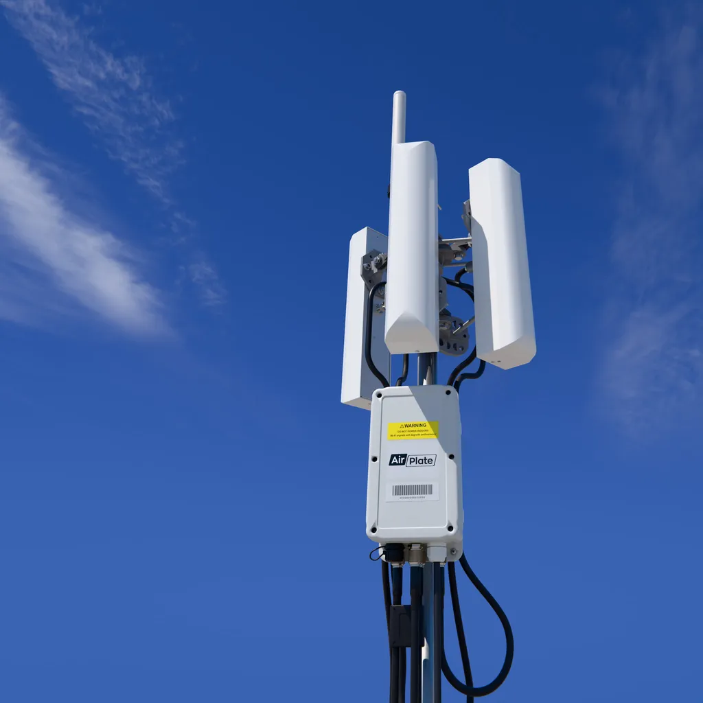 AirDetect Long Range on a mast: three tri-sector antennas and an omni antenna above the sensor enclosure