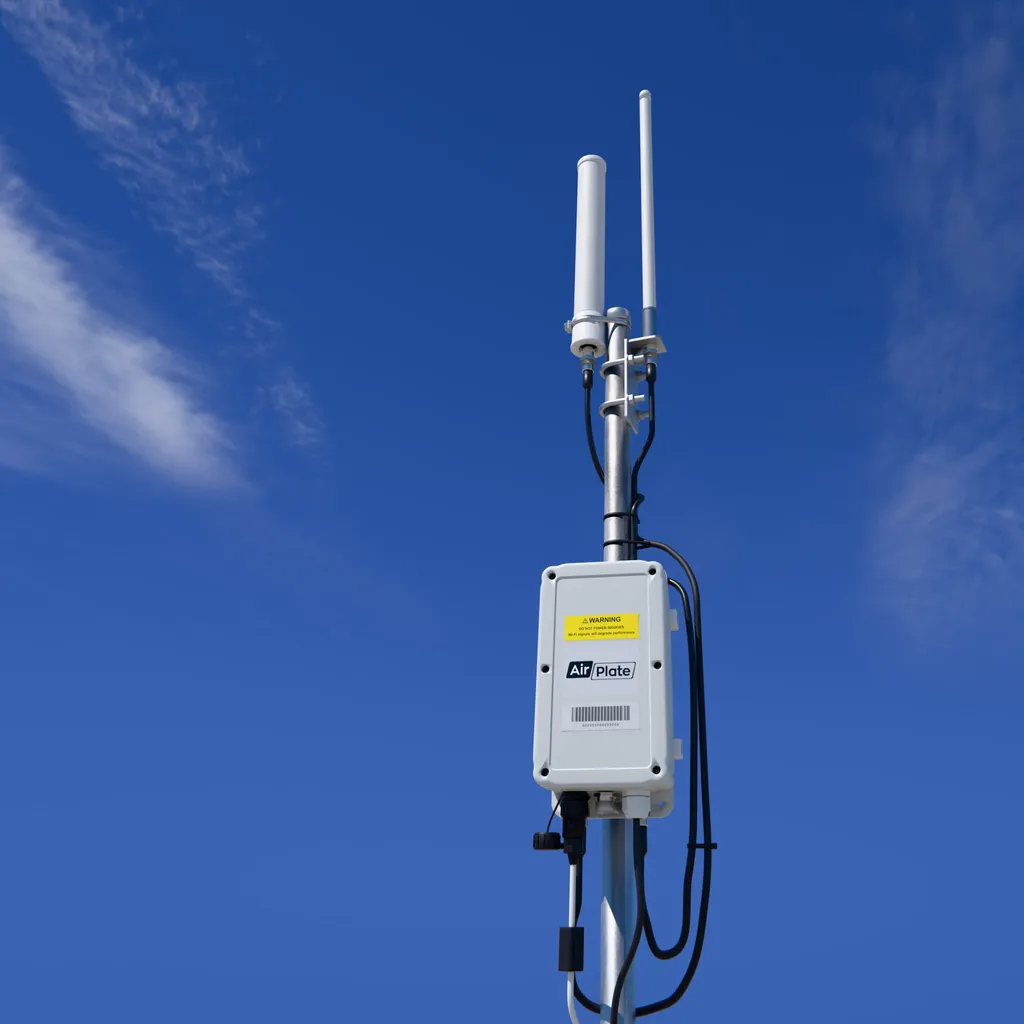 AirDetect Pro on a mast: two rod antennas above the sensor enclosure